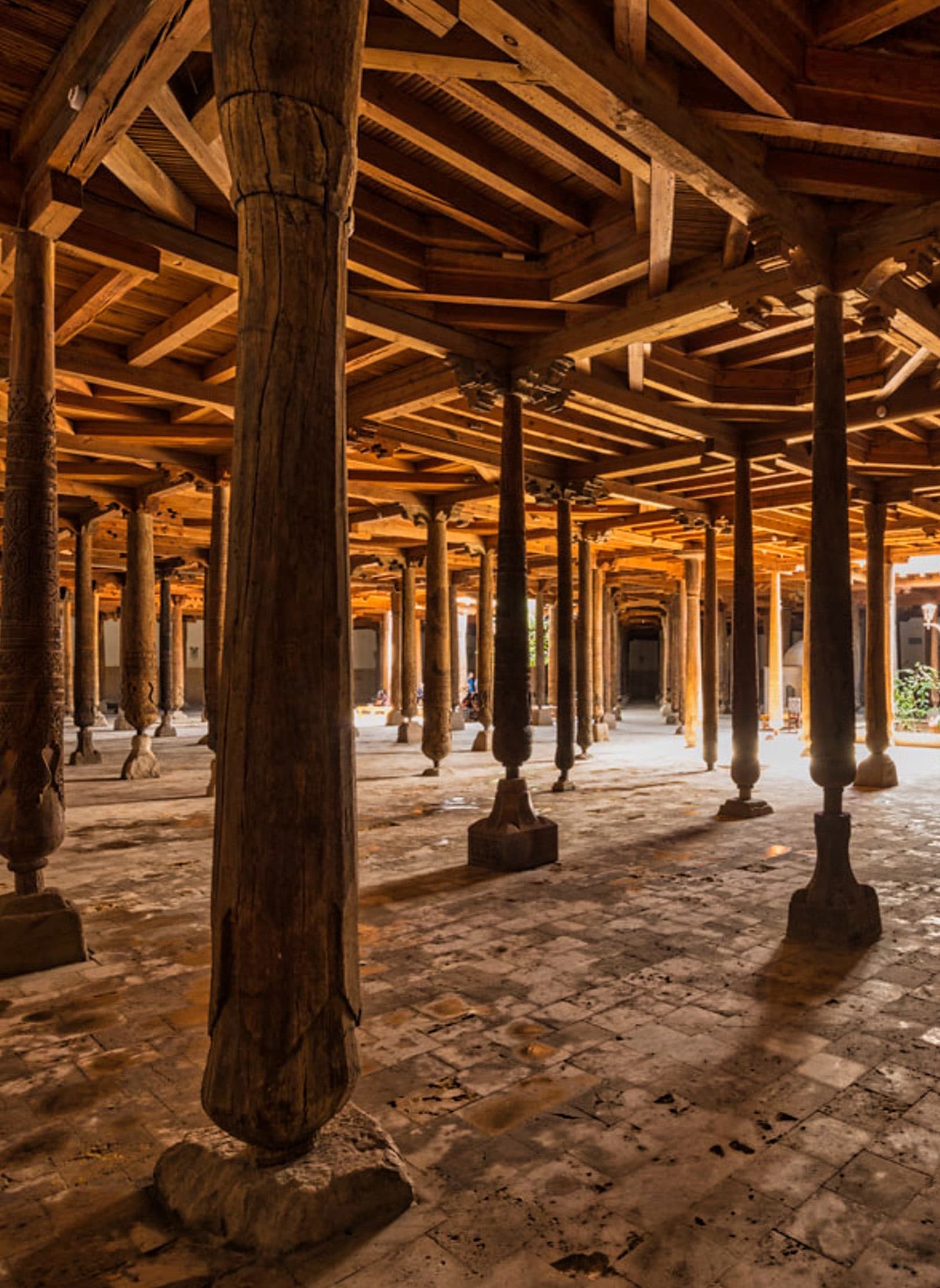 The hall of the Juma Mosque in Khiva with rows of carved wooden columns