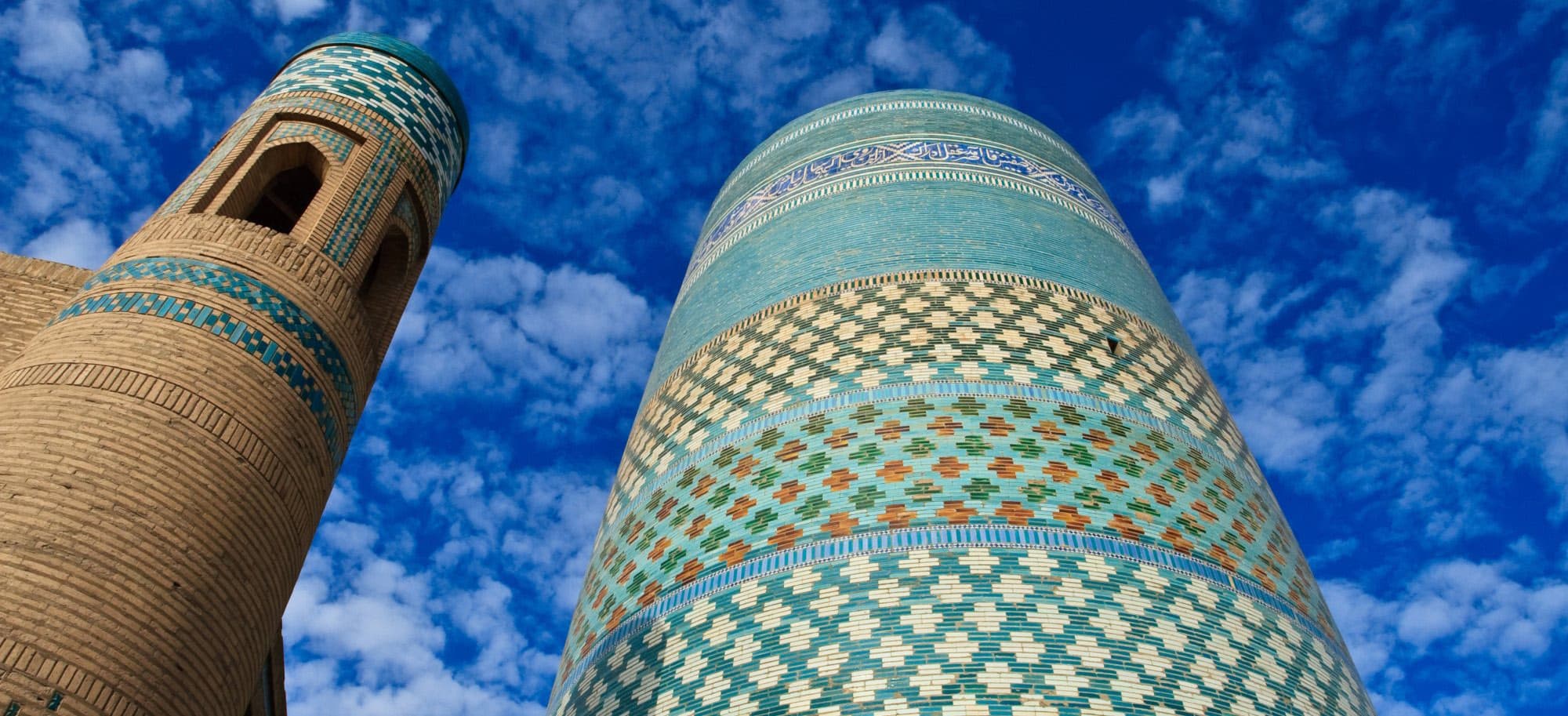 Kalta Minor seen from below, its turquoise glaze against a blue sky
